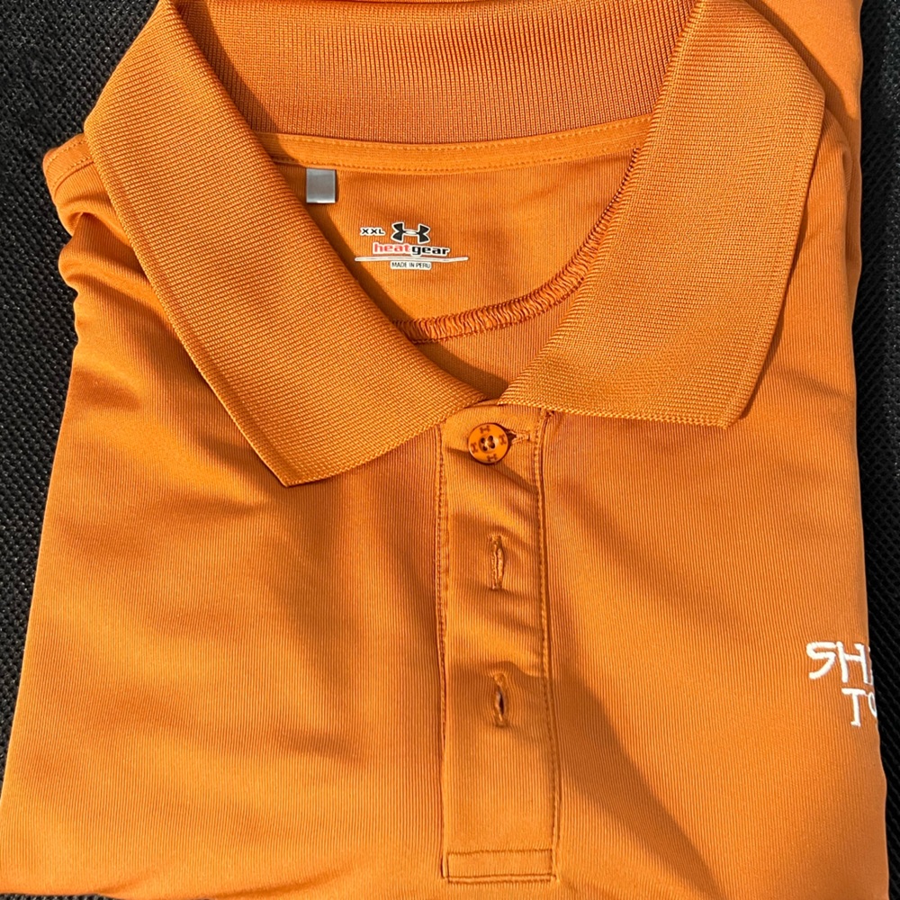 Under Armour golf polo XXL. Orange. From Sharks Tooth Golf Resort.